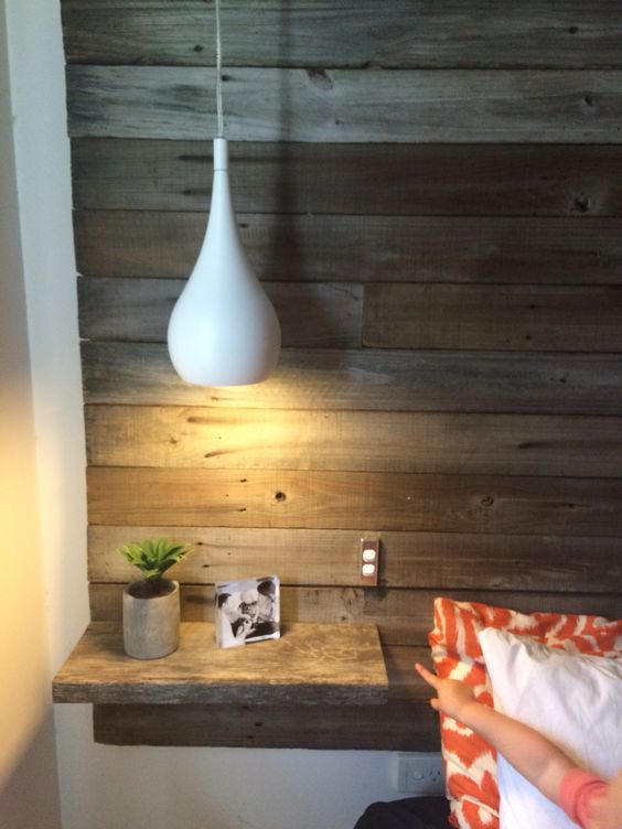 modern white bedside pendant lamps look contrasting with a reclaimed wood wall