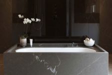 16 stone-clad free-standing bathtub looks luxurious