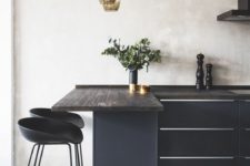 17 elegant black kitchen island with a wooden counter, small modern stools