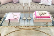 19 a gilded leg and frame table with a glass top is the most glam idea possible