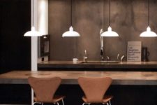 19 warm-colored concrete kitchen island and ocher leather chairs