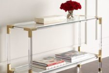 20 lucite and brass console looks fashionable and accomodates enough things