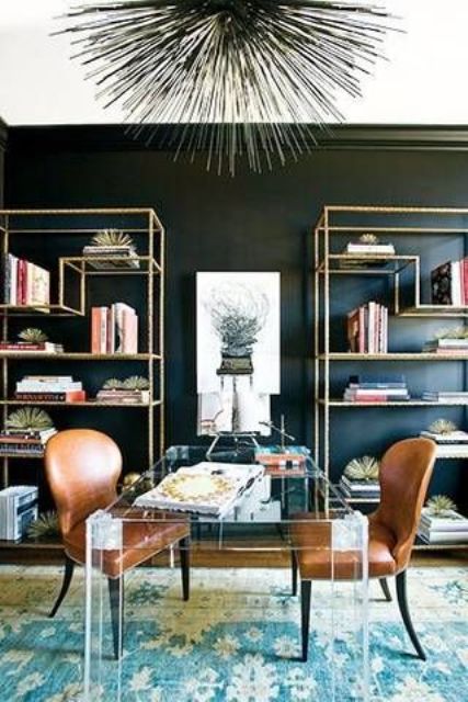 large lucite desk makes the leather chairs stand out