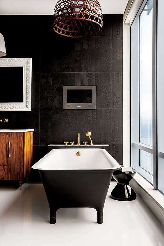 cool black bathtub on legs and with a black matte finish