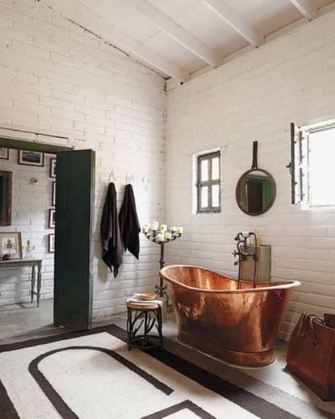 a free standing copper bathtub is always an elegant and eye catchy option