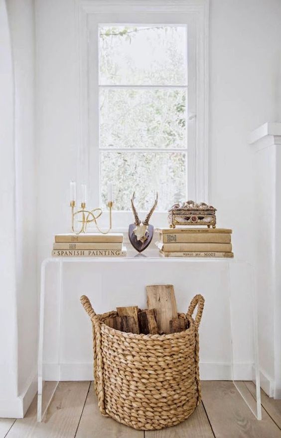 lucite bent console table accentuates a basket