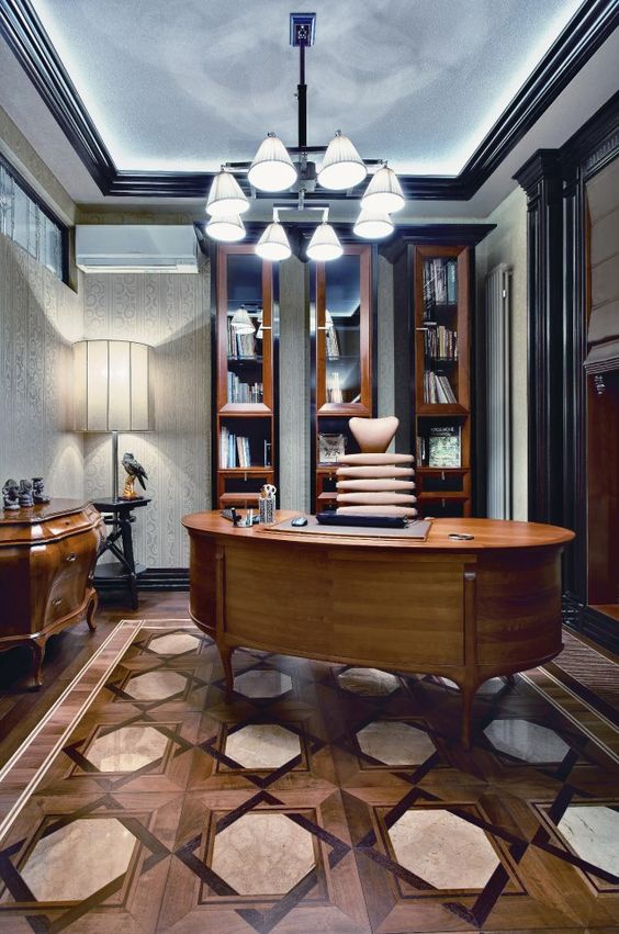 exquisite office design with glass booshelves and a sideboard