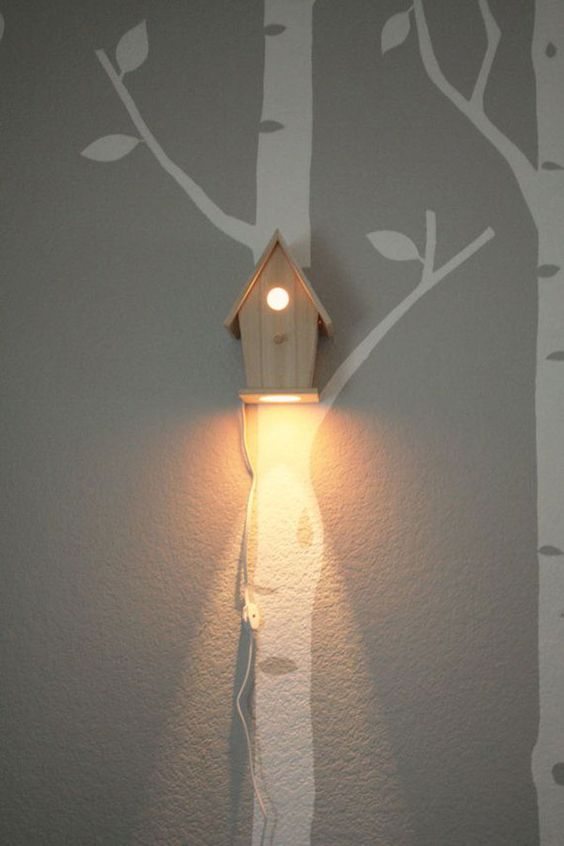 a bird house wall lamp is great for woodland-themed and rustic kids rooms