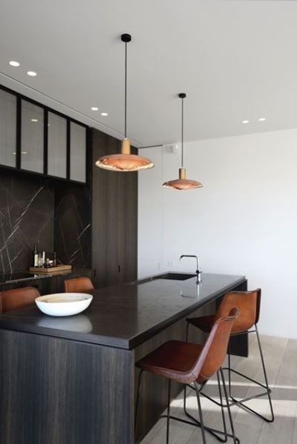 dark wood kitchen island and ocher leather chairs