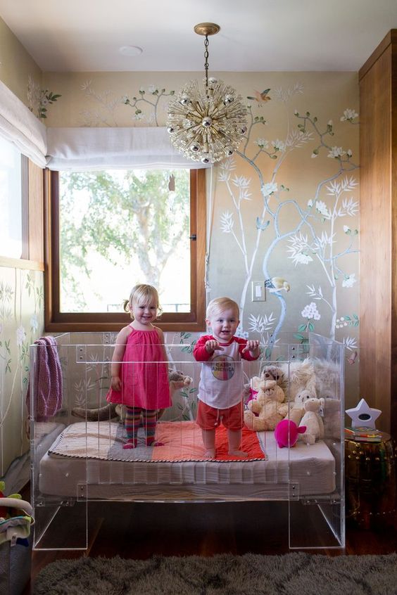 glam nursery design with an acrylic crib