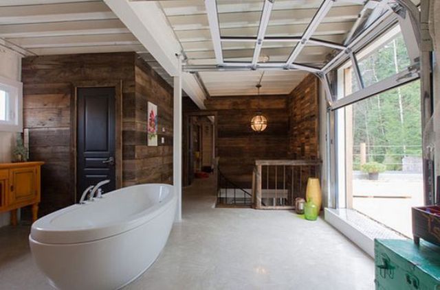 glass garage door opens the bathroom to outdoors perfectly