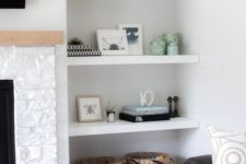 26 white floating shelves in a niche are a great idea for a modern living room