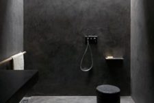 29 dark concrete all over the shower for a minimalist look