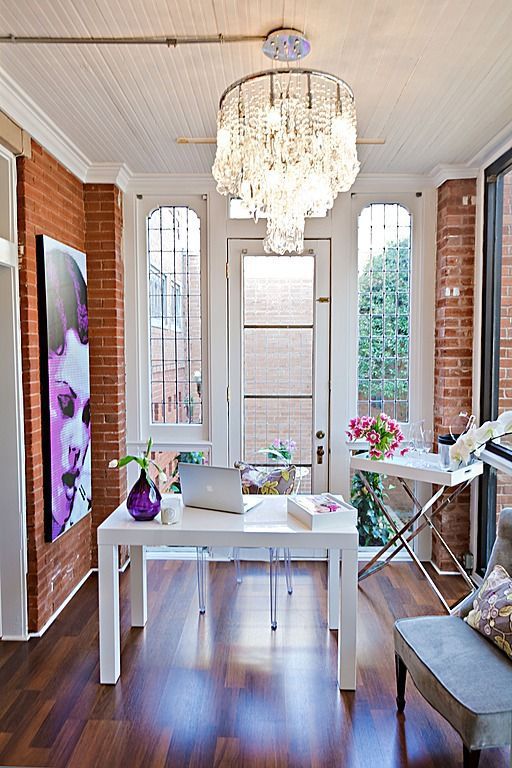 oversized crystal chandelier over the desk is a cool glam idea