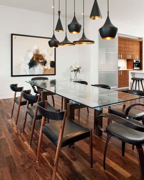 a whole composition of pendant lamps in black matte and shiny gold inside
