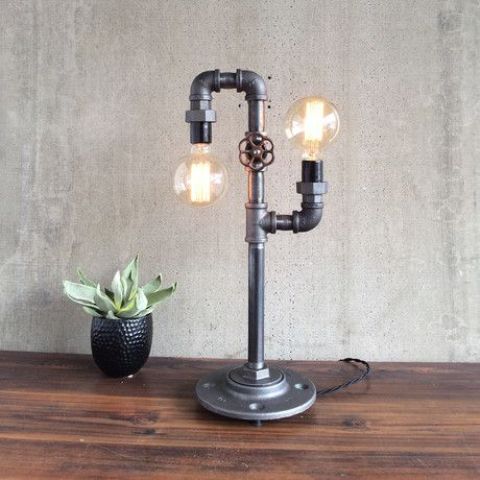 double industrial table lamp with bulbs and a faucet