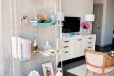 33 ladder-style lucite shelving unit disappears next to the concrete wall