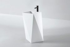 33 white sculptural faceted sink with a black faucet for a modern bathroom