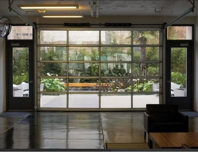modern garage doors is a perfect way to enjoy your zen backyard garden from indoors (Lux Garage Doors)