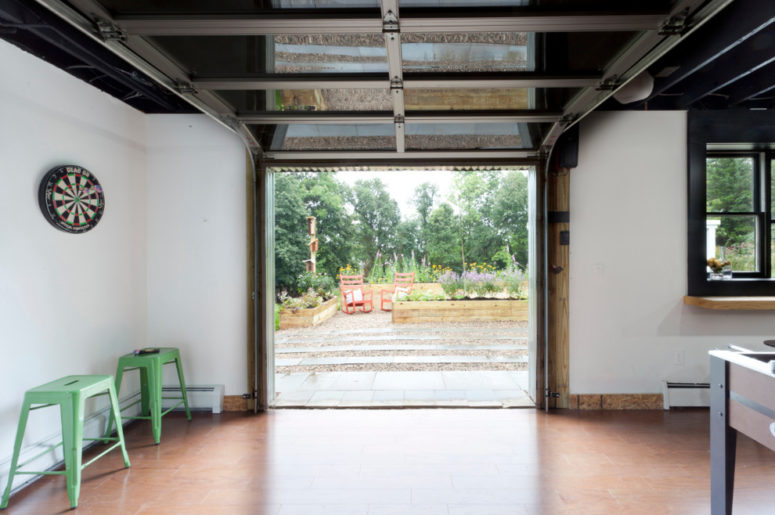 a rolling up garage door is a great way to combine a basement entertainment area with outdoors