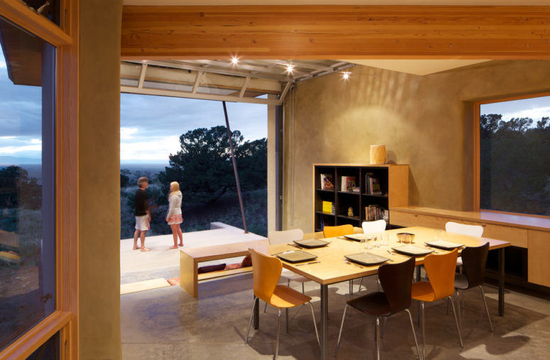 a wall-size glass door that opens onto a patio with a gorgeous valley view is a must for a vacation home (Gettliffe Architecture)