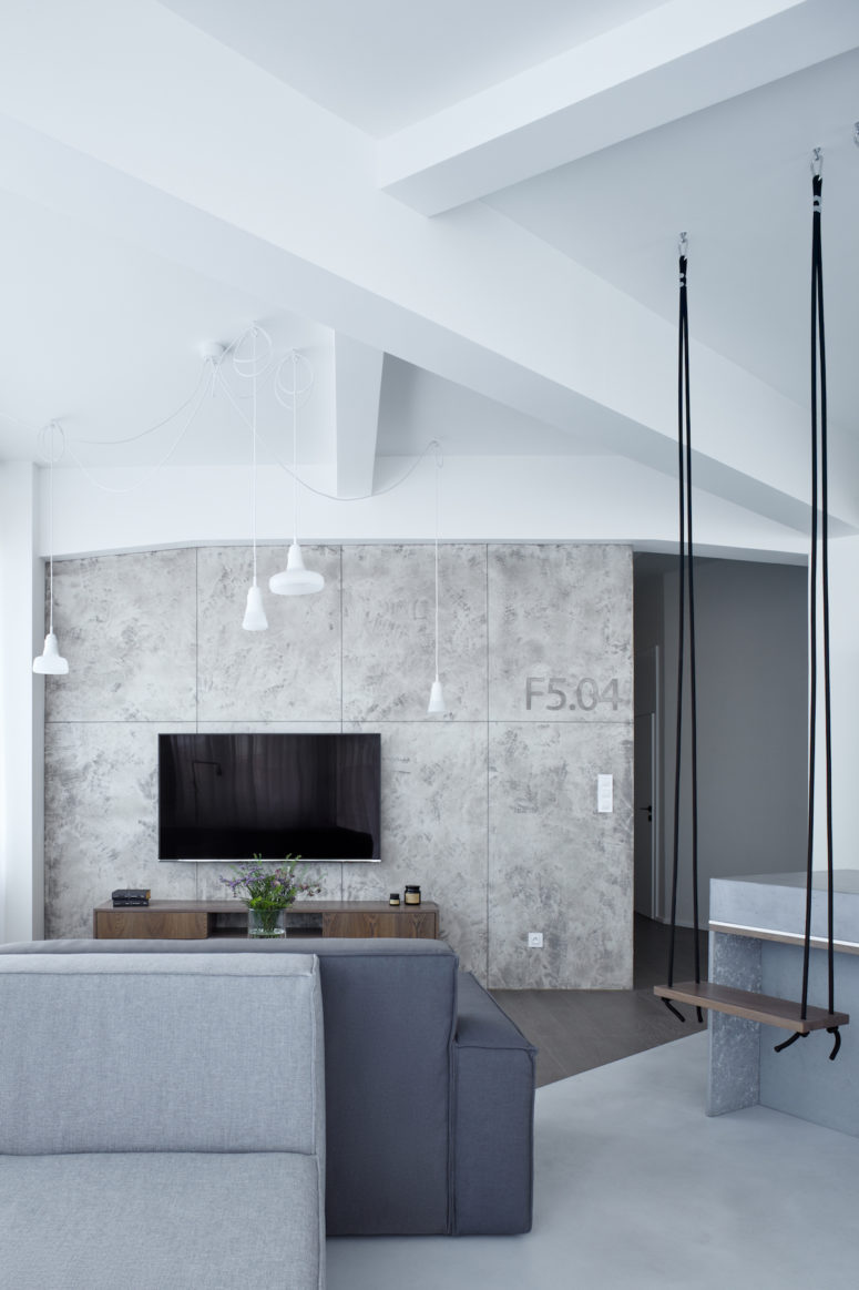 concrete panels for decor High ceilings were highlighted with pendant lamps, and concrete panels reminded of industrial nature of the building