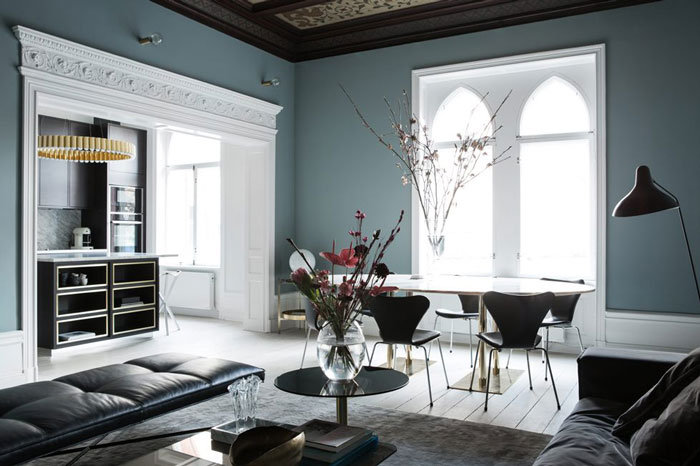 cozy floors design The grey blue walls are combines with whitewashed floors and vaulted ceilings for a unique look and an airy feel