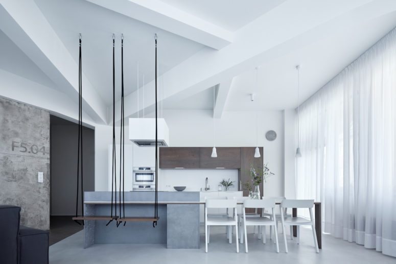 concrete kitchen decor A sculptural ceiling looks stunning, and swing seats for the breakfast zone are a cool idea, I also love a concrete kitchen island