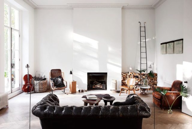 The living space features white walls and wooden floors and modern furniture of leather and rattan the owner decided to emphasize the interiors with textures The living space features white walls and wooden floors and modern furniture of leather and rattan - the owner decided to emphasize the interiors with textures