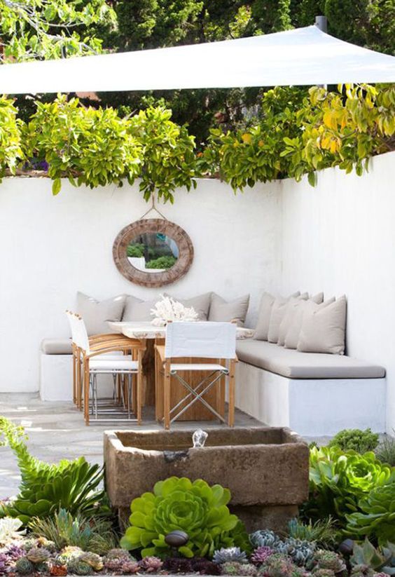 a L-shaped bench with storage used as a seat for a dining zone