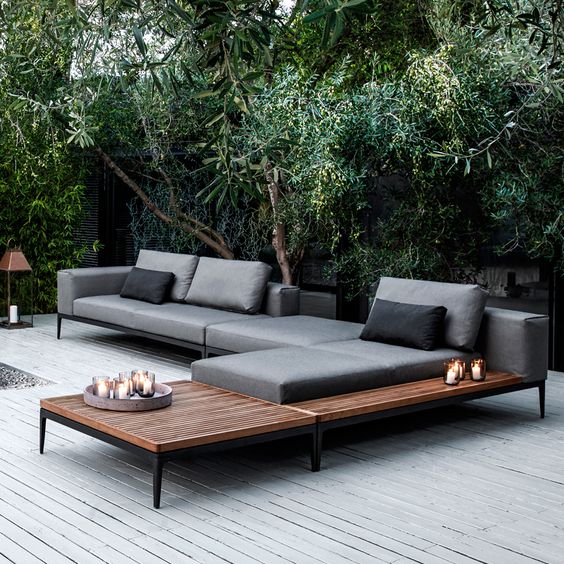 modular chaise lounge sofa on blackened metal frames and soft grey cushions