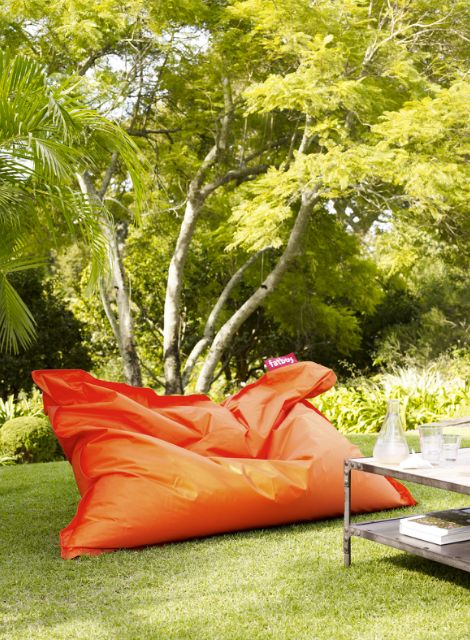 oversized bright orange bean bag seat instead of a sofa