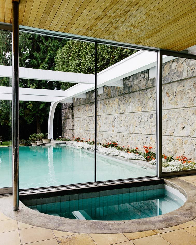 cool indoor outdoor pool In the main house a small infinity pool extends from the middle level, disappearing into the landscape