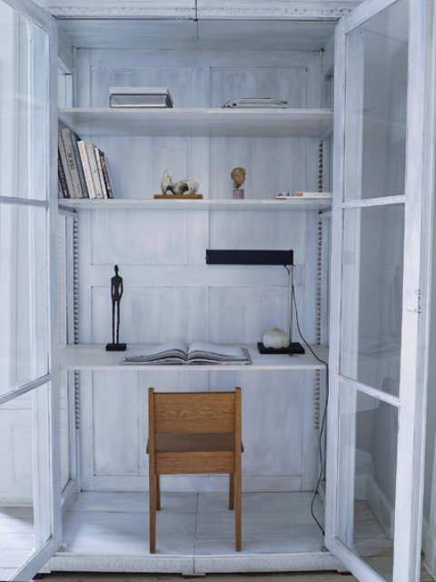 super small home office design The closet was turned into a small home office with whitewashed walls, doors and shelves, such a cool solution
