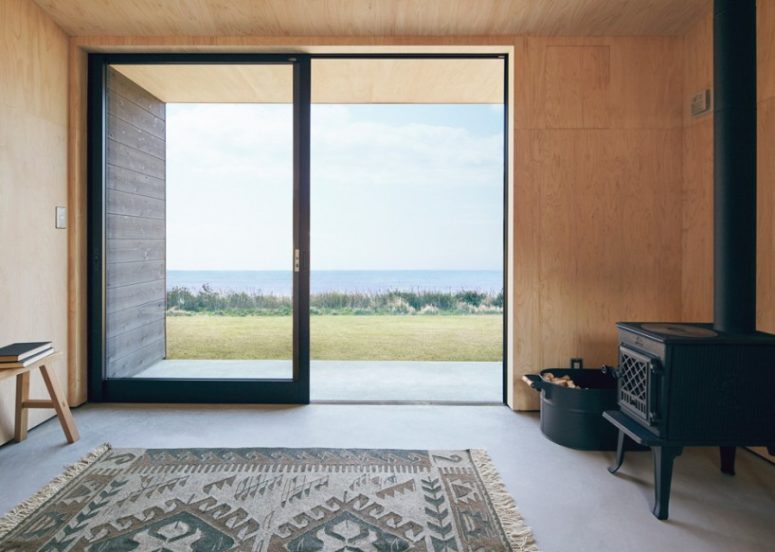 cozy space There's everything necessary for a weekend getaway and lots of wood and a rug make the space much cozier