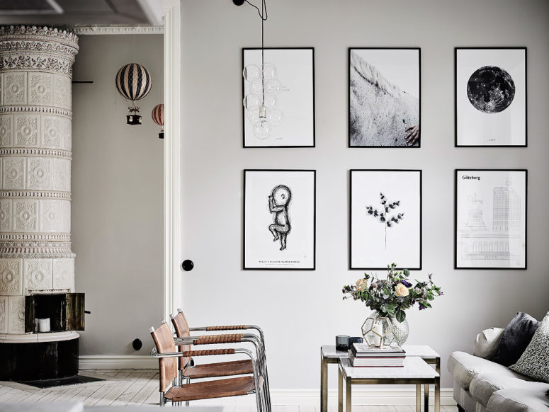 Brown leather chairs and black and white artworks add eye-catchiness to the space