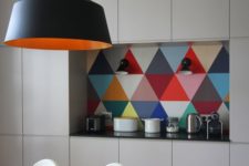 08 a colorful geometric backsplash makes this plain modern kitchen pop