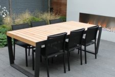 08 a minimalist table with black emtal legs and light-colored wooden tabletop