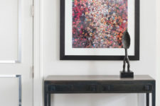 09 The entryway features a very bold artwork and a metal console