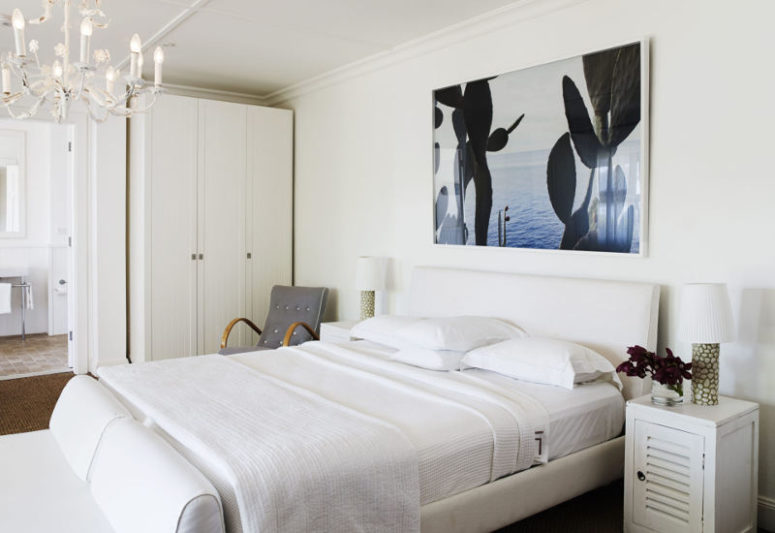 artwork to refresh a bedroom's look The first bedroom is decorated in creamy whites and neutrals, with a large photo artwork