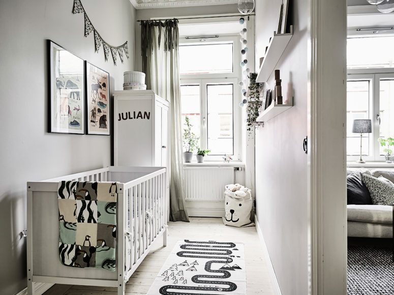 scandinavian style kids room The kid's space is small, with colored artworks and textiles and a printed rug