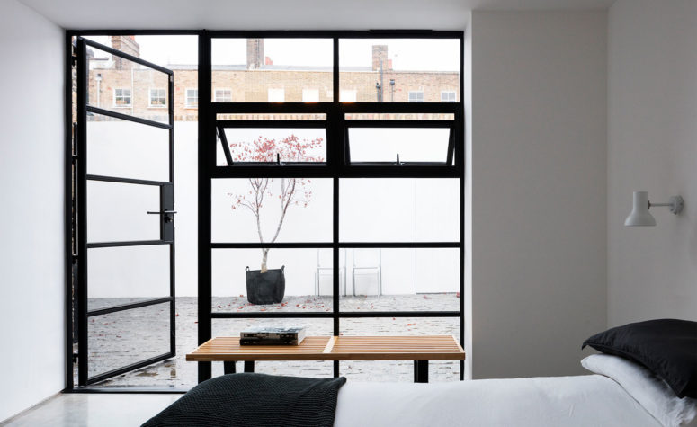 The second bedroom is connected to the inner courtyard with glass doors and it makes it super inviting