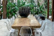 09 a gorgeous rough wood table with legs and lucite chairs look natural and modern