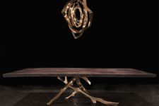 11 a dark stained table with bronze branch legs and a matching pendant