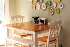 11 colorful and patterned plate wall over the dining zone