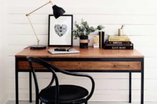 12 a modern desk in black framing and with stained wood