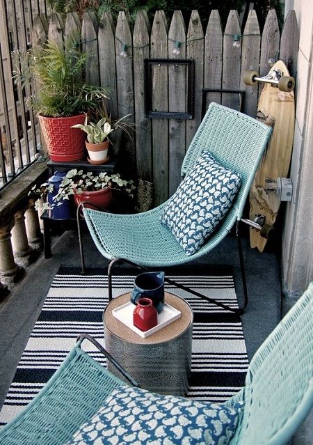 blue wicker chairs on a black frame stand out and remind of beaches