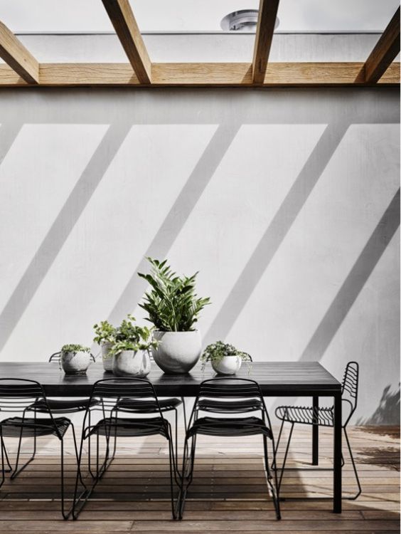 30 Awesome Outdoor Dining Area Furniture Ideas Digsdigs Black Dining Table And Metal Chairs For A Chic Modern Terrace