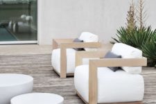15 cool light-colored wooden chairs with armrests and white upholstery