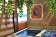 18 a Morocco-inspired outdoor space with two tubs – one usual and another a spa one